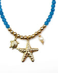 Collar Chicona estrella de mar , perla y tortuga