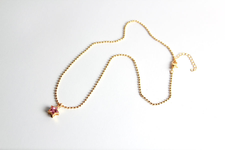 Collar dorado dije estrella rosa