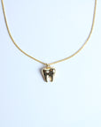 Collar muela dorada