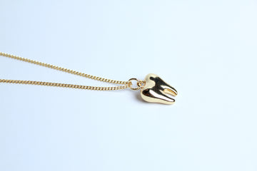 Collar muela dorada