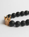 Pulsera Hombre Cuentas Negras con Corona Dorada