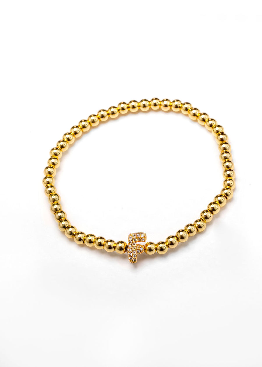 Pulsera inicial dorada