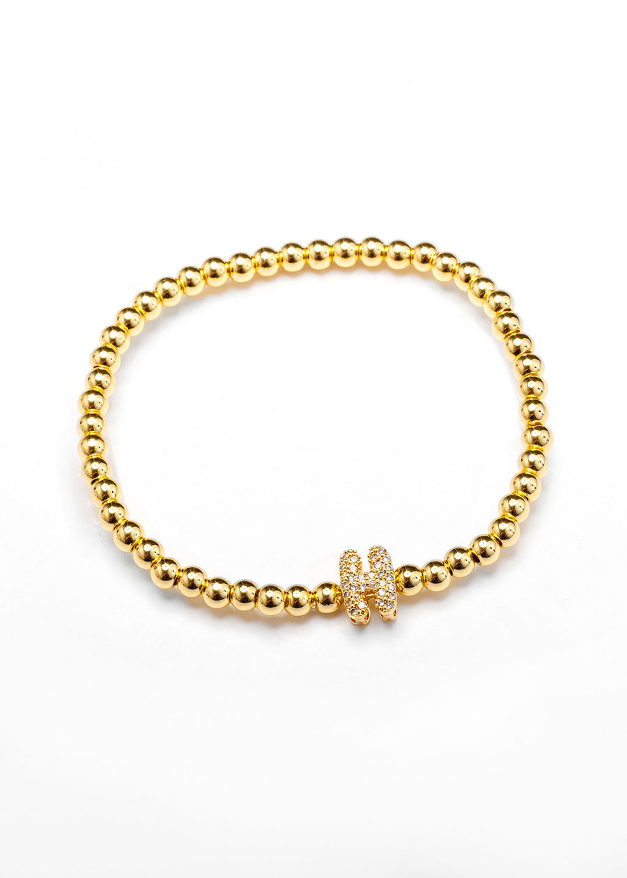 Pulsera inicial dorada